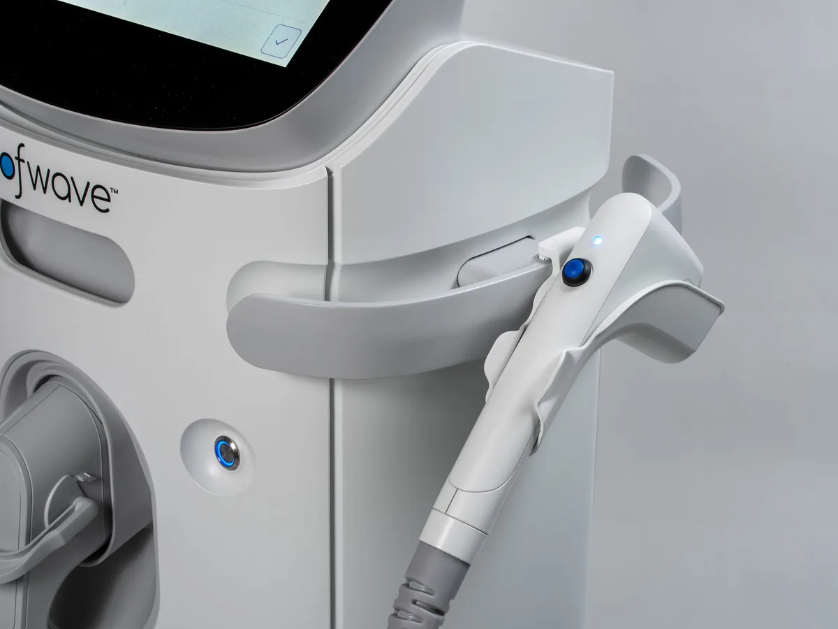 Close-up of an ultrasound aesthetic device with its handheld applicator